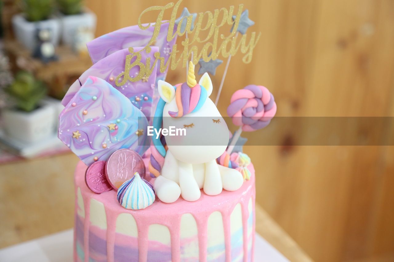 Close-up of birthday cake on table