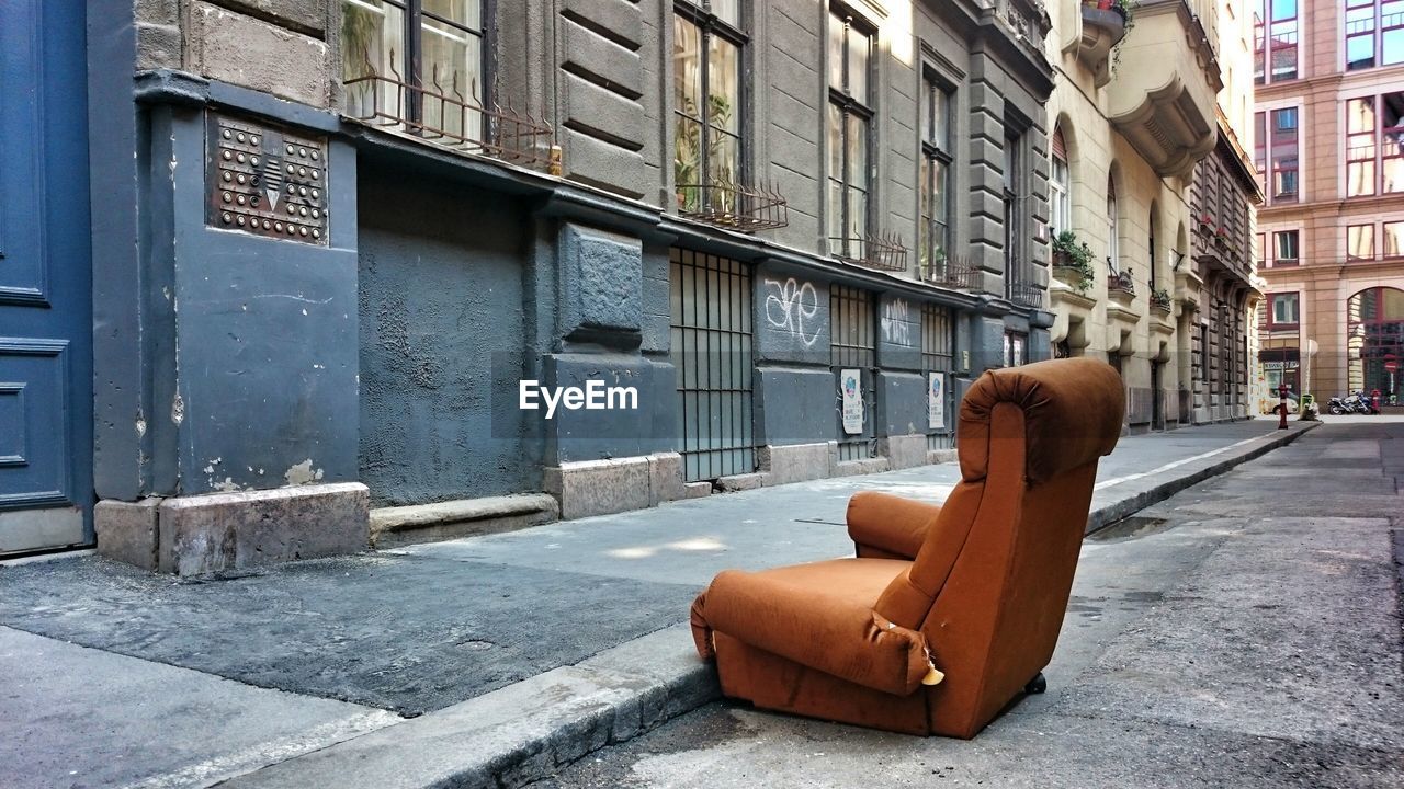 Empty armchair in the street 