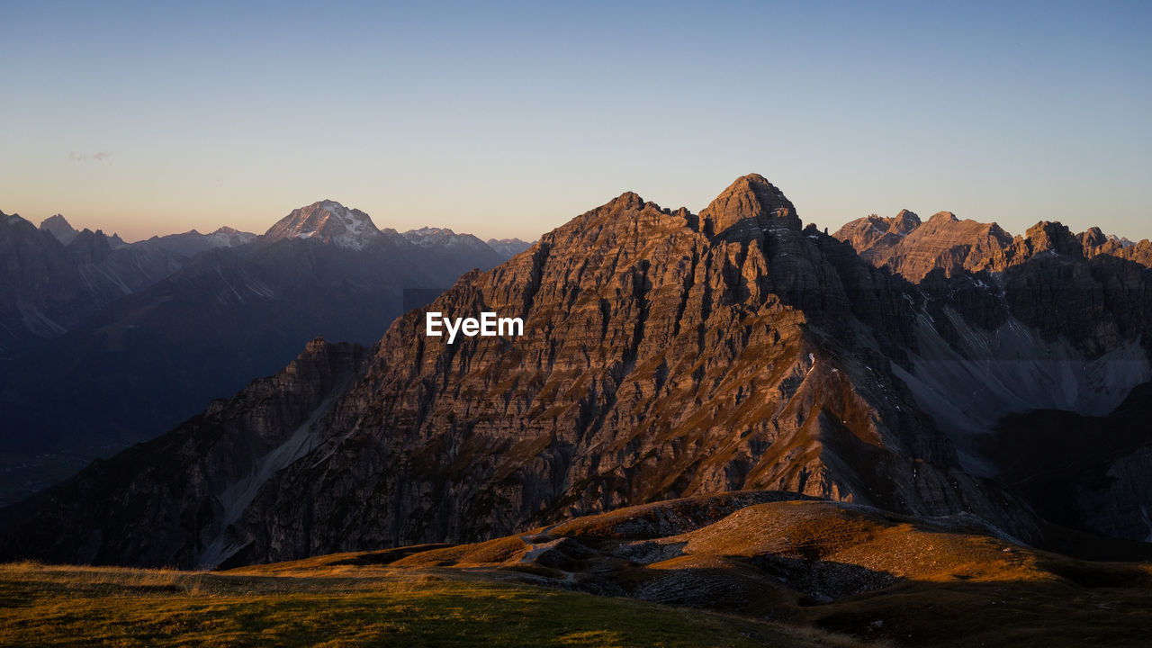 Scenic view of snowcapped mountains against clear sky