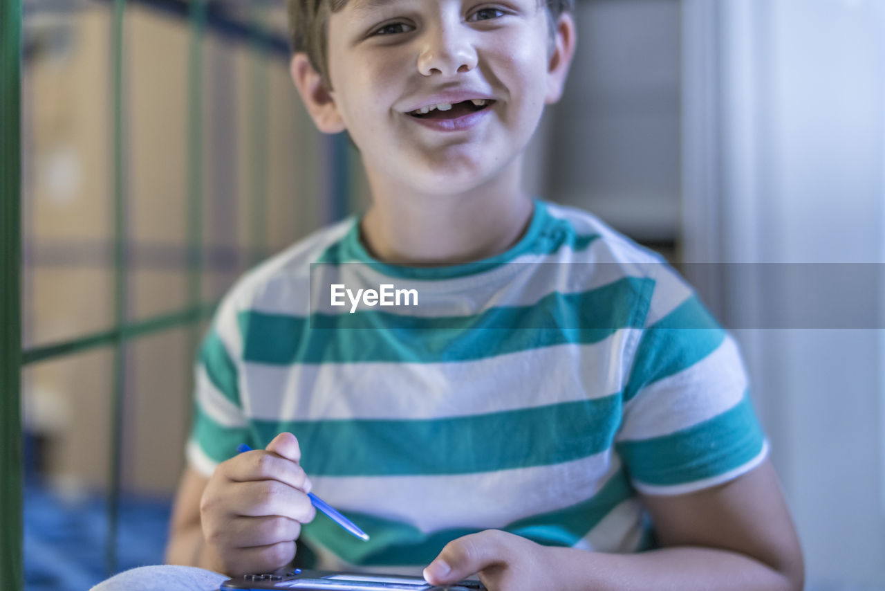 Close-up of boy using tablet
