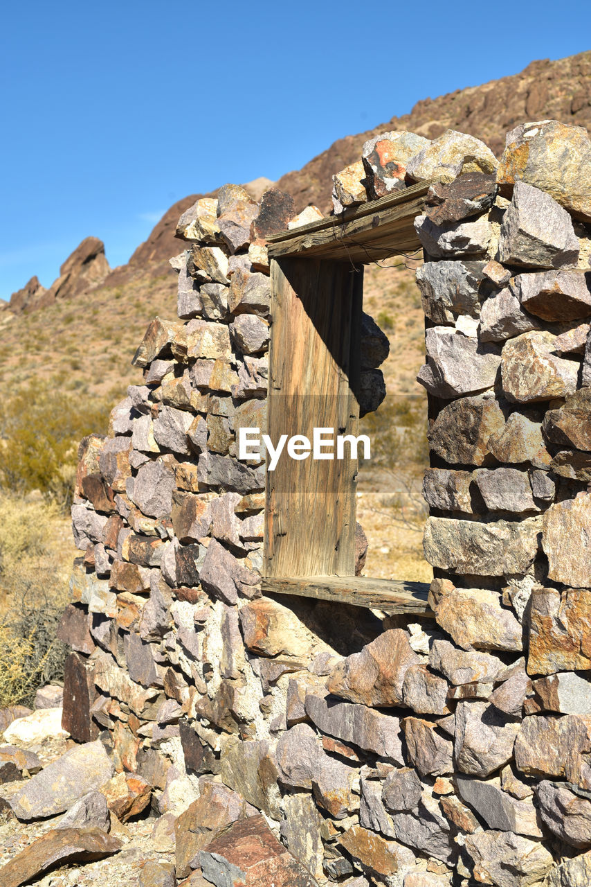 STONE WALL AGAINST MOUNTAIN