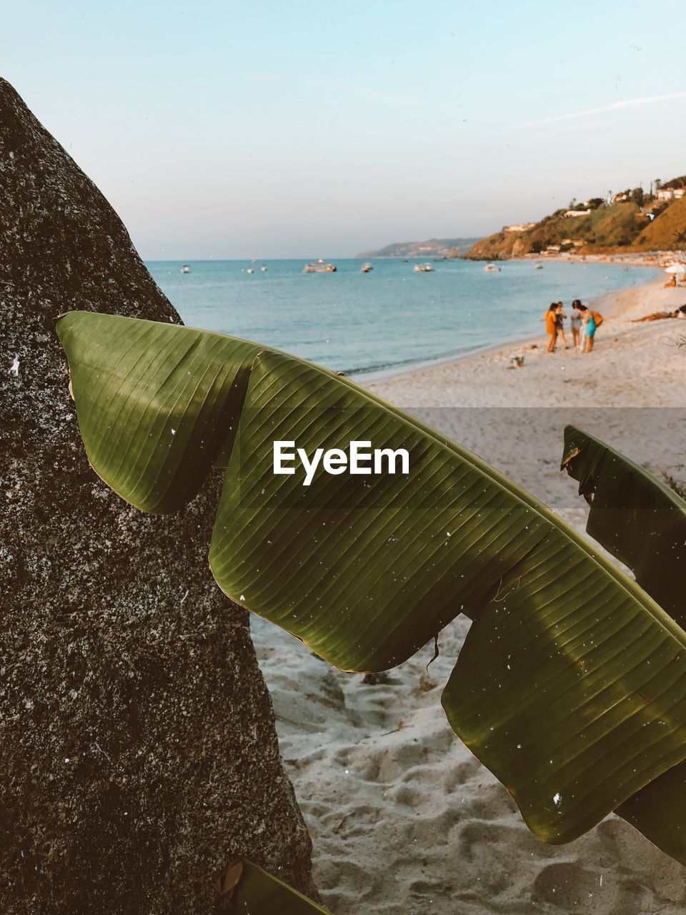 CLOSE-UP OF BEACH AGAINST SKY