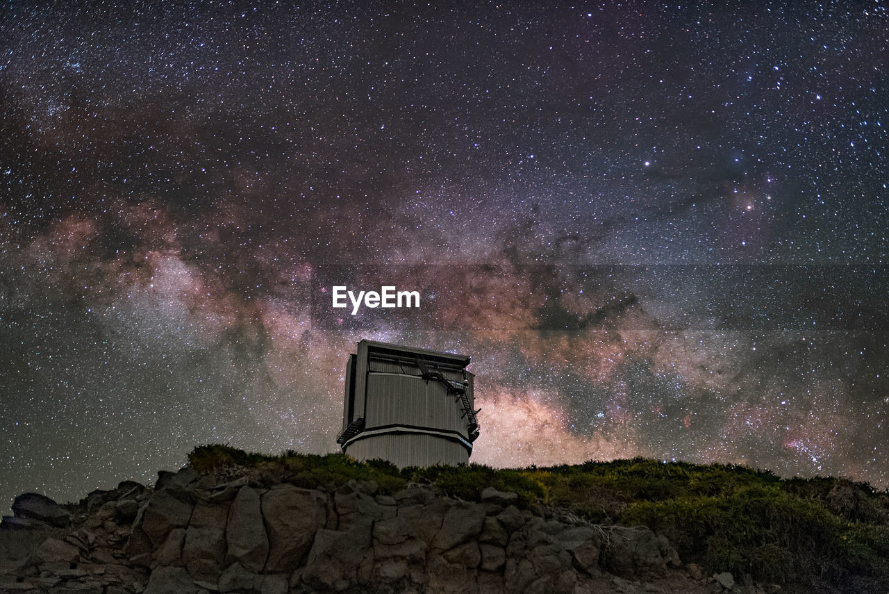 Built structure against sky at night