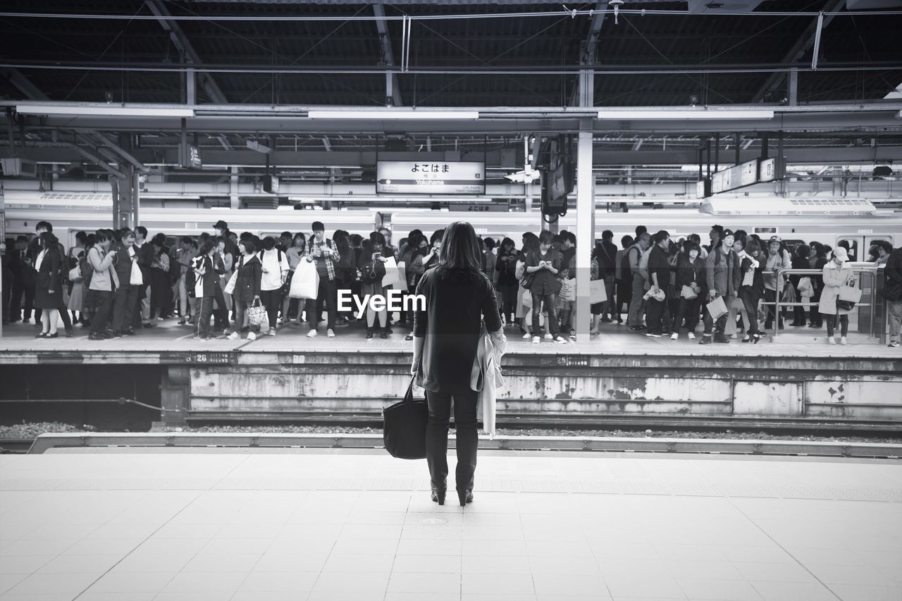 PEOPLE AT RAILROAD STATION