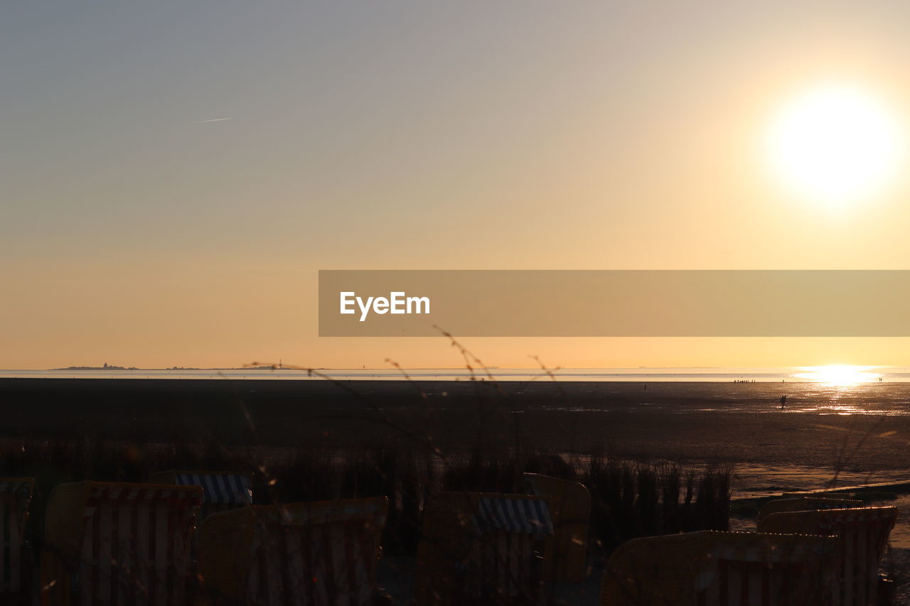 SCENIC VIEW OF SUNSET OVER SEA