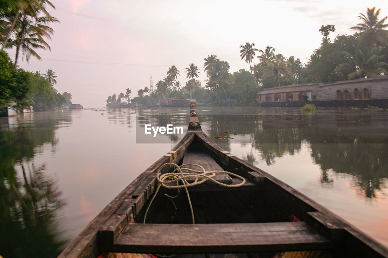 Boat on kerala backwaters against sky