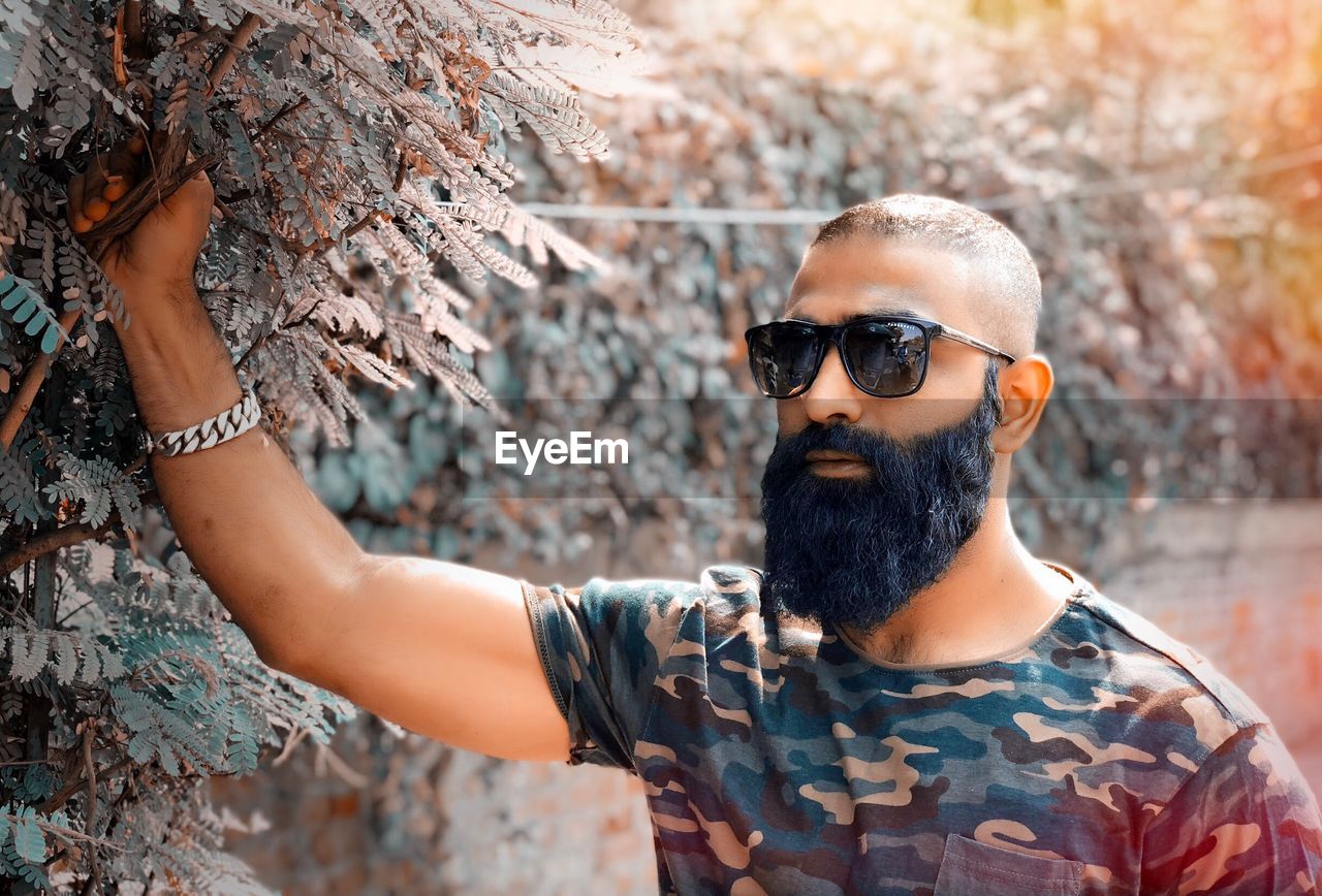 Man standing by plants