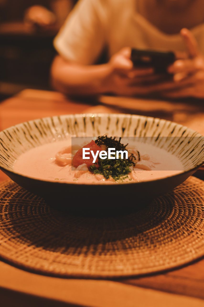 food and drink, food, plate, dinner, meal, one person, table, dish, indoors, healthy eating, adult, wellbeing, crockery, restaurant, freshness, business, place setting, eating, focus on foreground