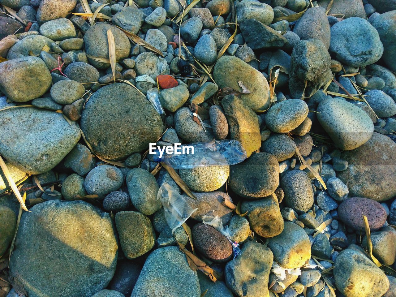 High angle view of stones on beach