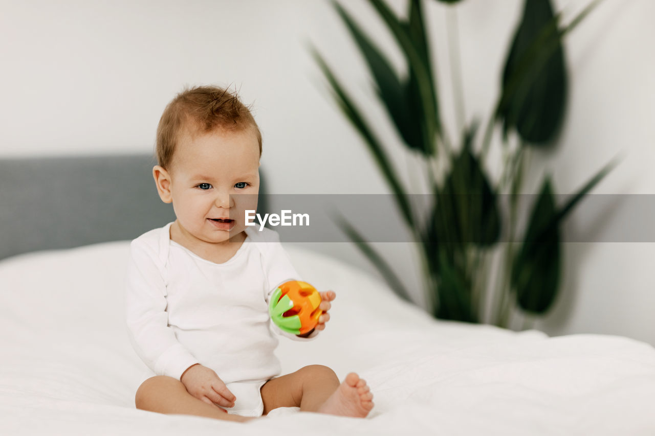 Portrait of cute boy on bed