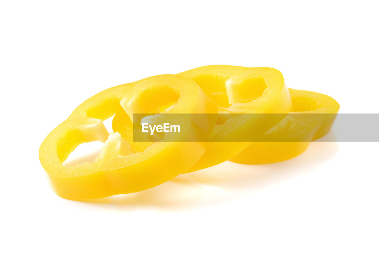 CLOSE-UP OF LEMON AGAINST WHITE BACKGROUND