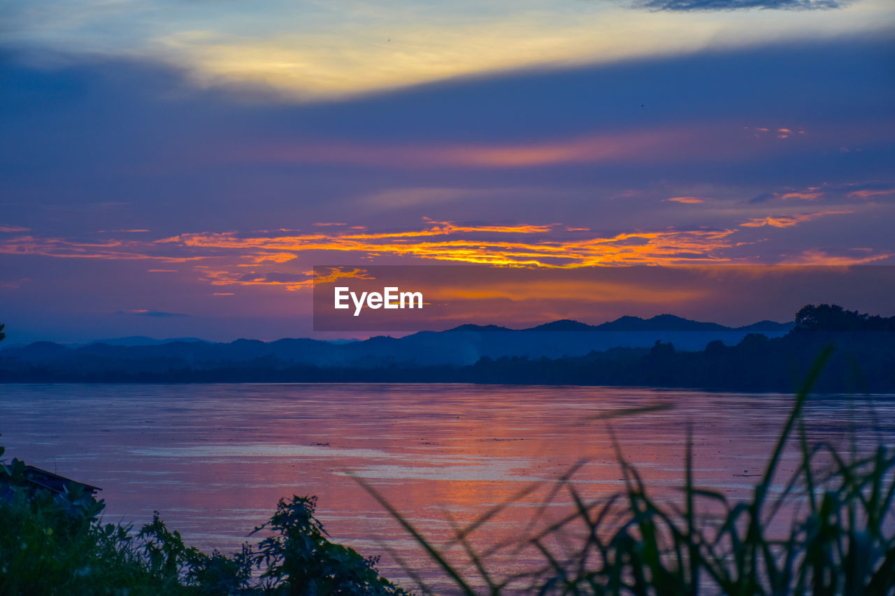 SCENIC VIEW OF LAKE DURING SUNSET