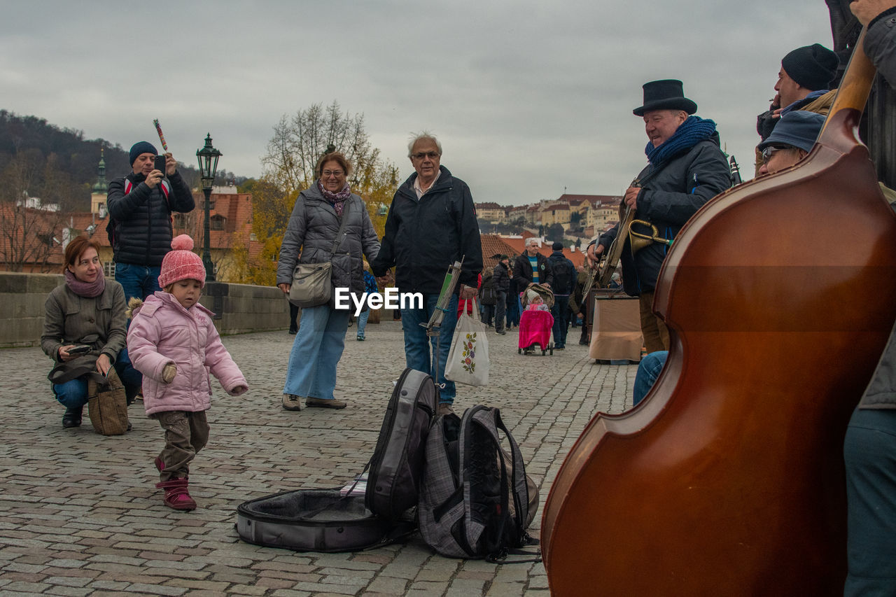 GROUP OF PEOPLE AT MUSIC FESTIVAL