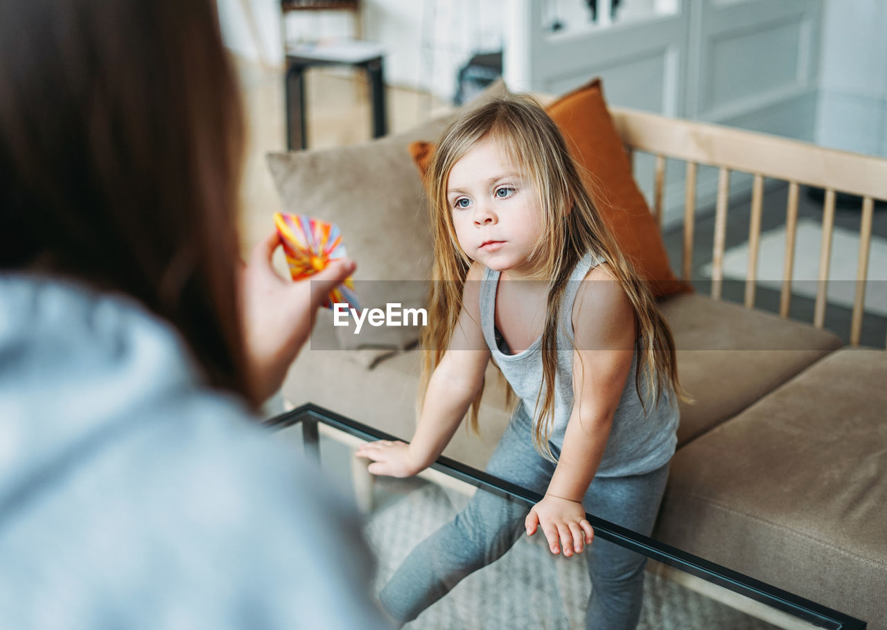 High angle view of woman and daughter playing