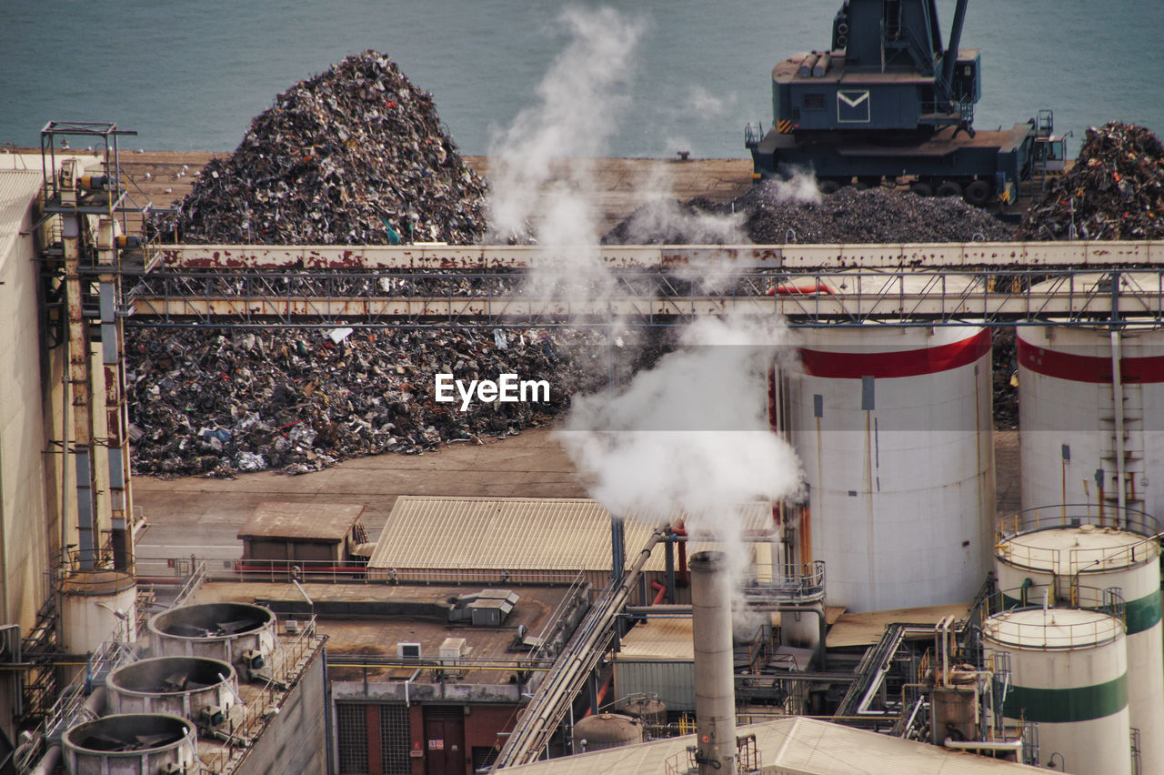 High angle view of smoke emitting from factory