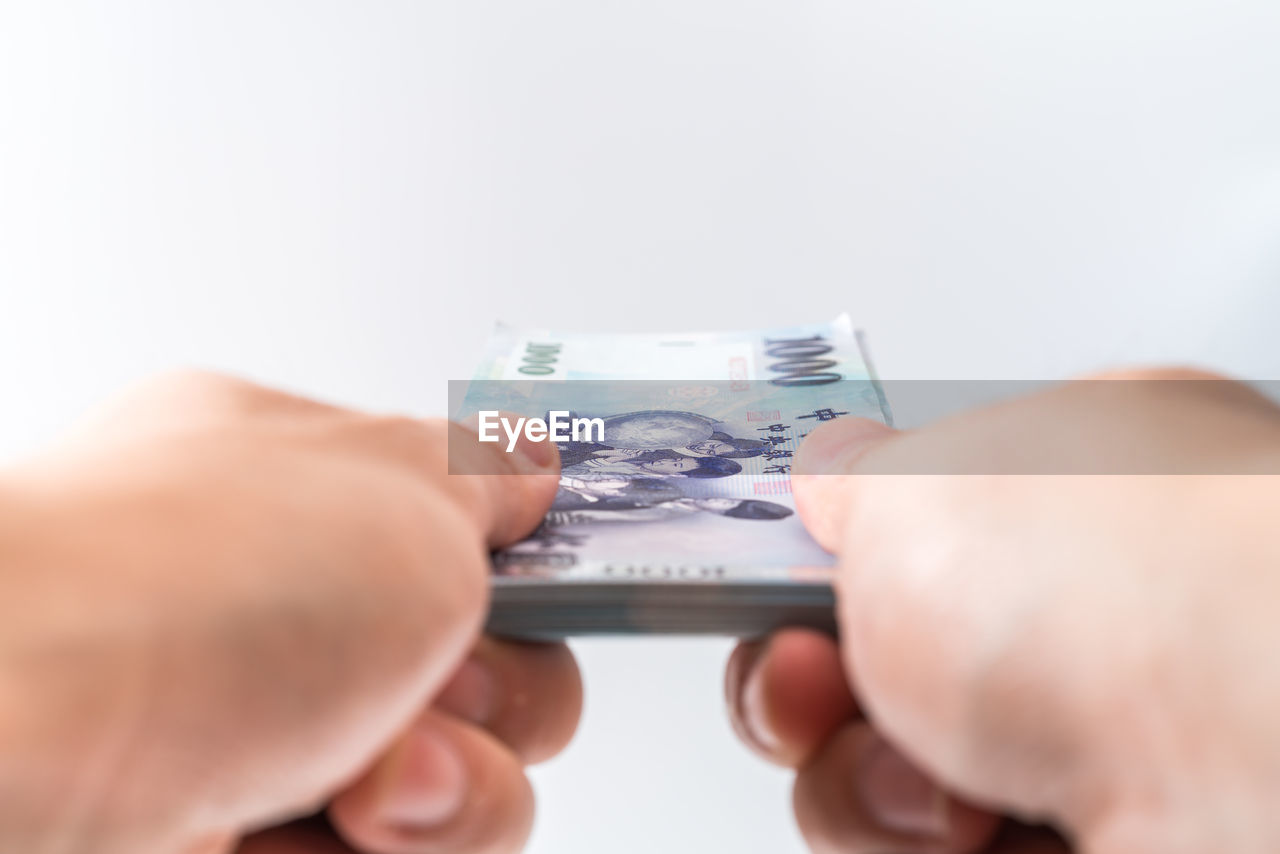 hand, finance, business, currency, cash, holding, paper currency, money, adult, wealth, finger, close-up, men, indoors, studio shot, consumerism, paying, buying, banking, savings, mature adult, retail, finance and economy, one person, debt, investment