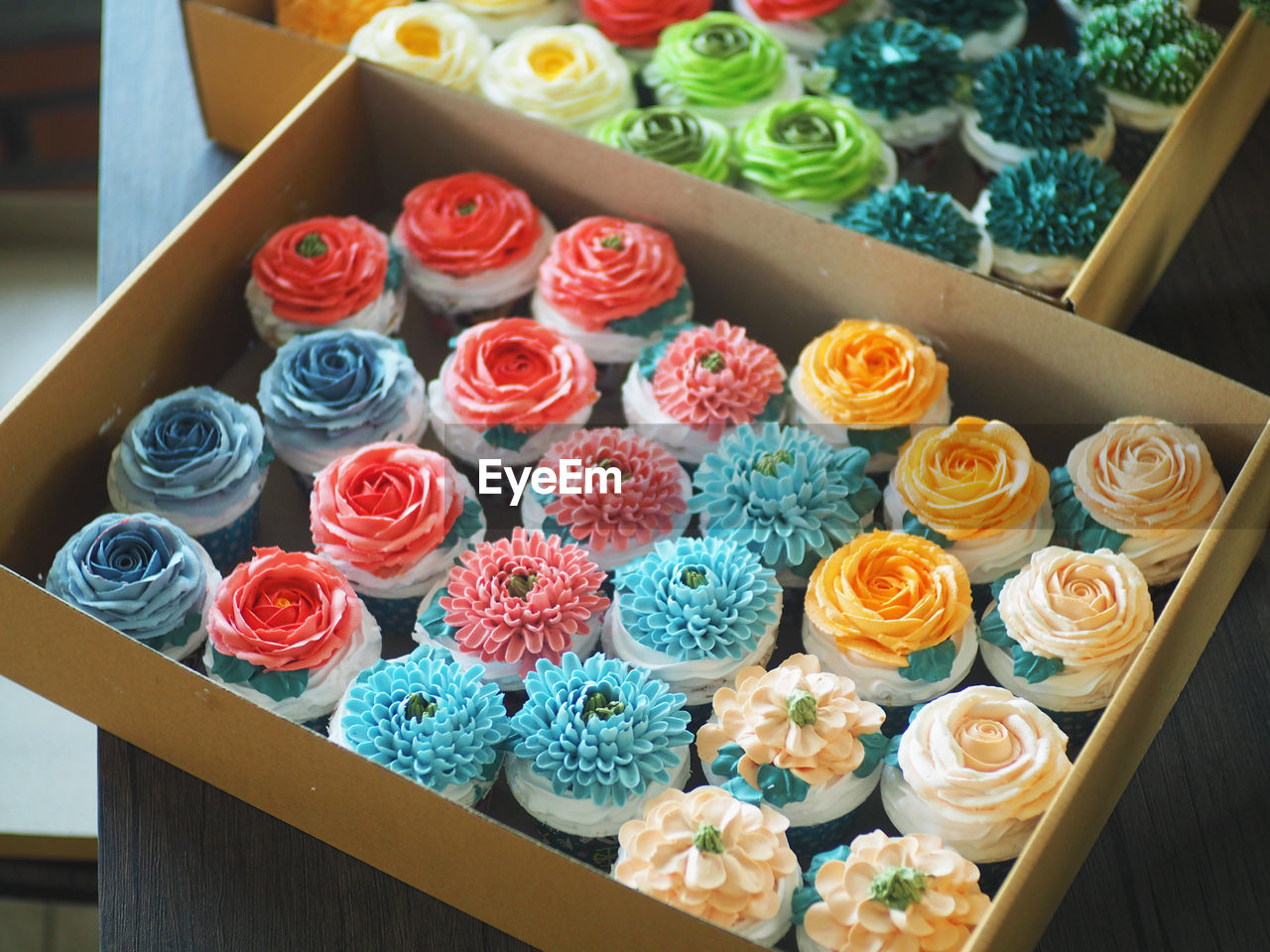 High angle view of multi colored roses on table