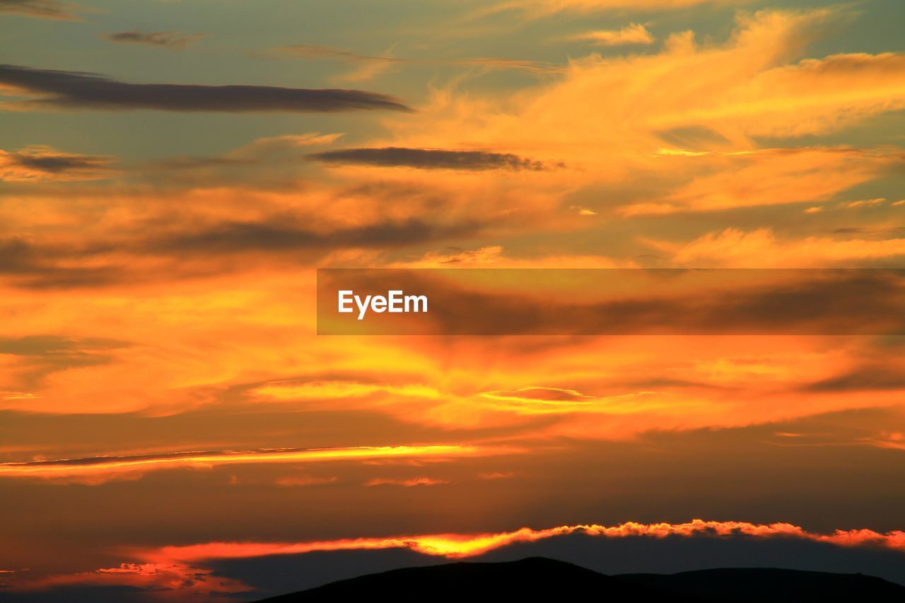 Scenic view of dramatic sky during sunset