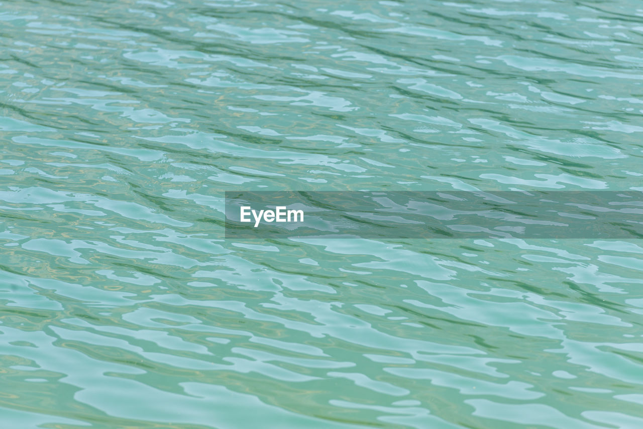 FULL FRAME SHOT OF RIPPLED LAKE