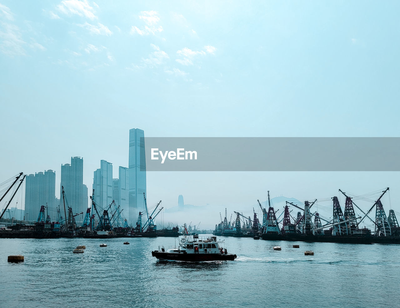Boats in sea with the mist