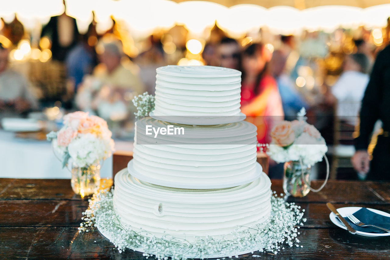 Close-up of cake on table in ceremony