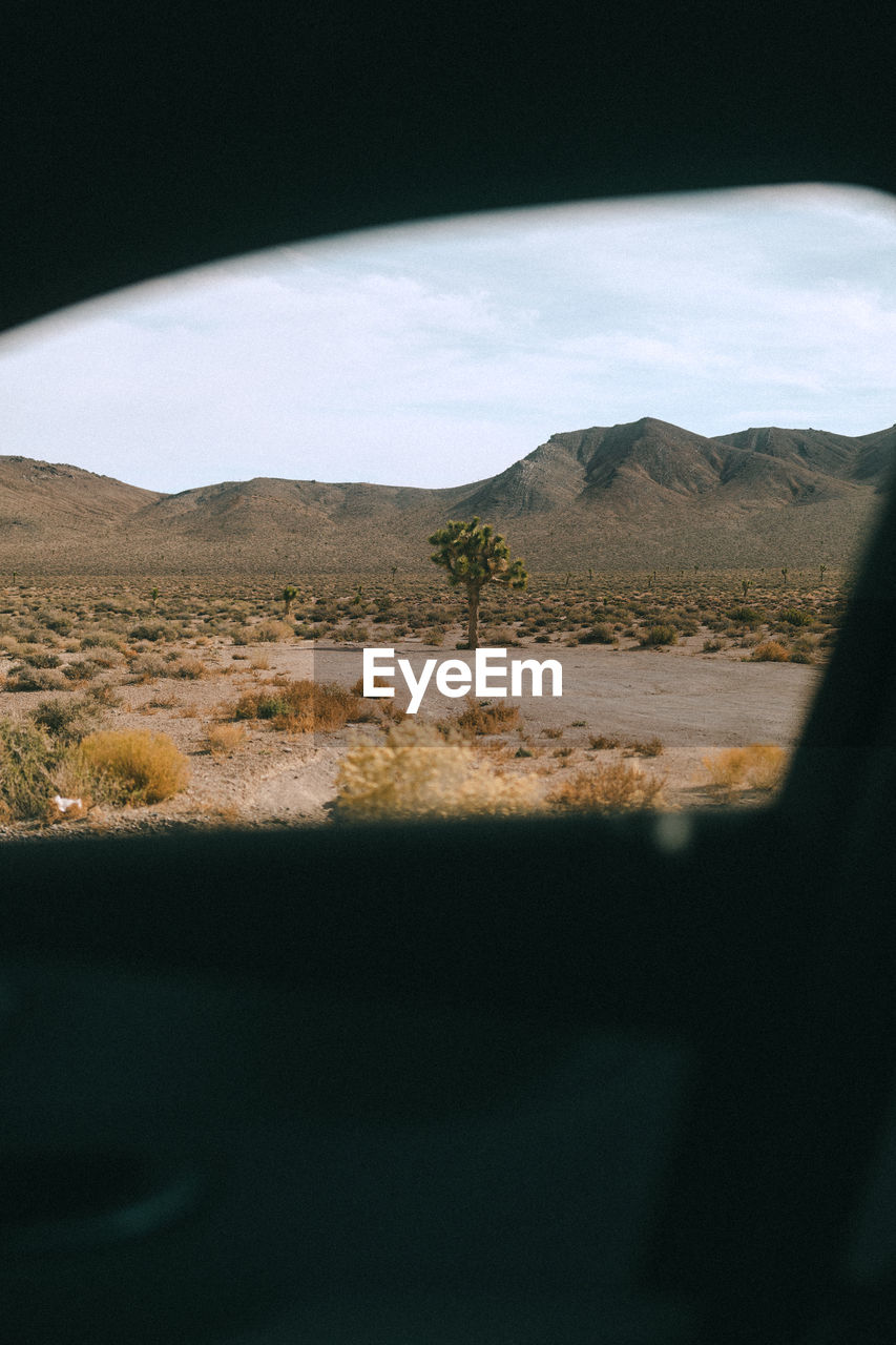 SCENIC VIEW OF LANDSCAPE SEEN FROM CAR WINDSHIELD