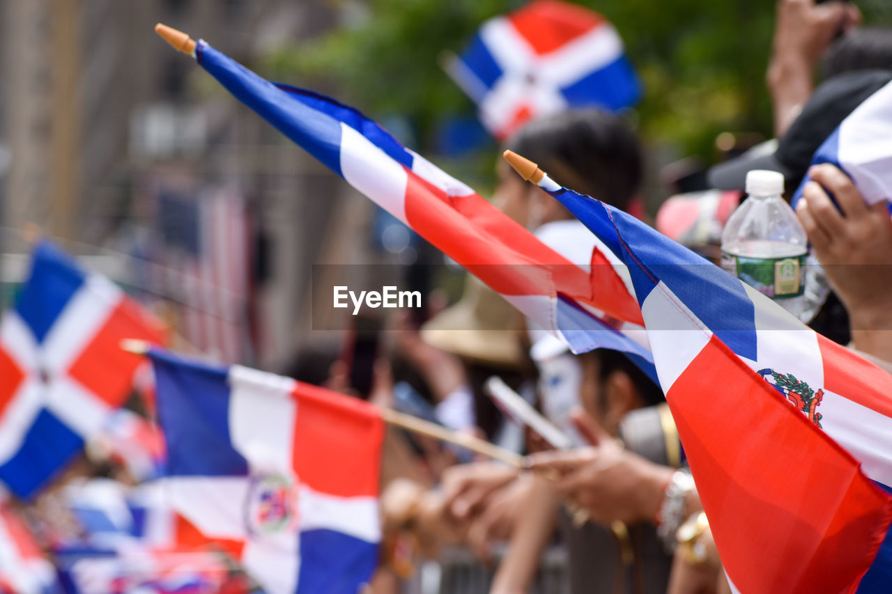 Dominican flags are seen at the dominican day parade along avenue of the americas in new york city.