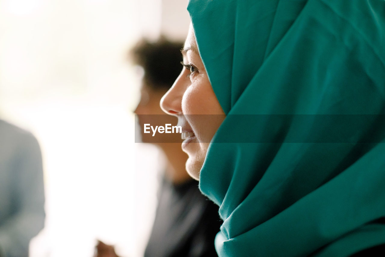Close-up of businesswoman wearing hijab during meeting