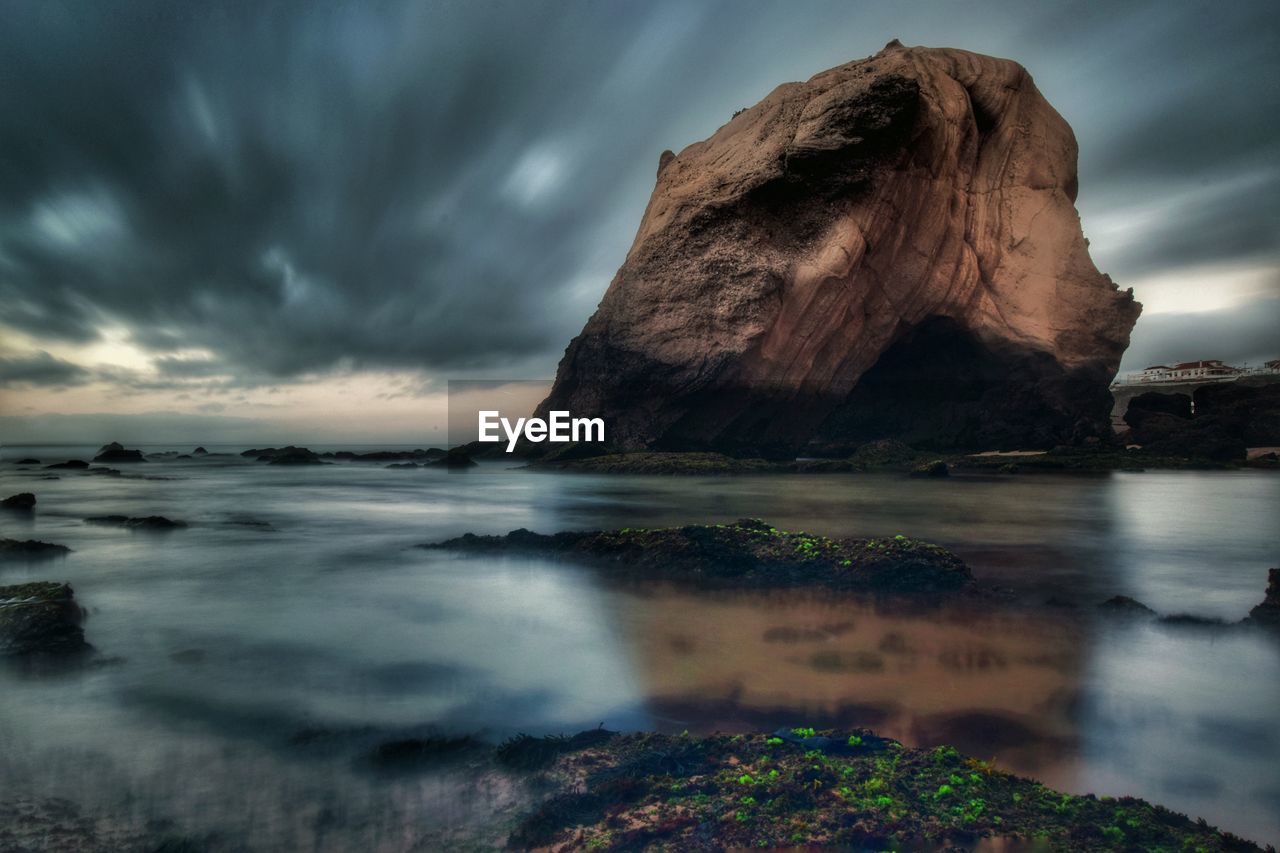 Rock formation in sea at penedo do guincho