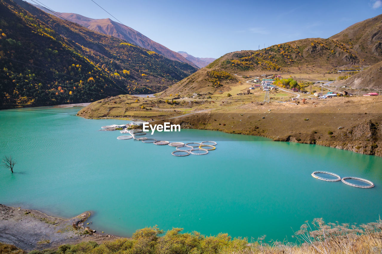 high angle view of sea and mountains against sky