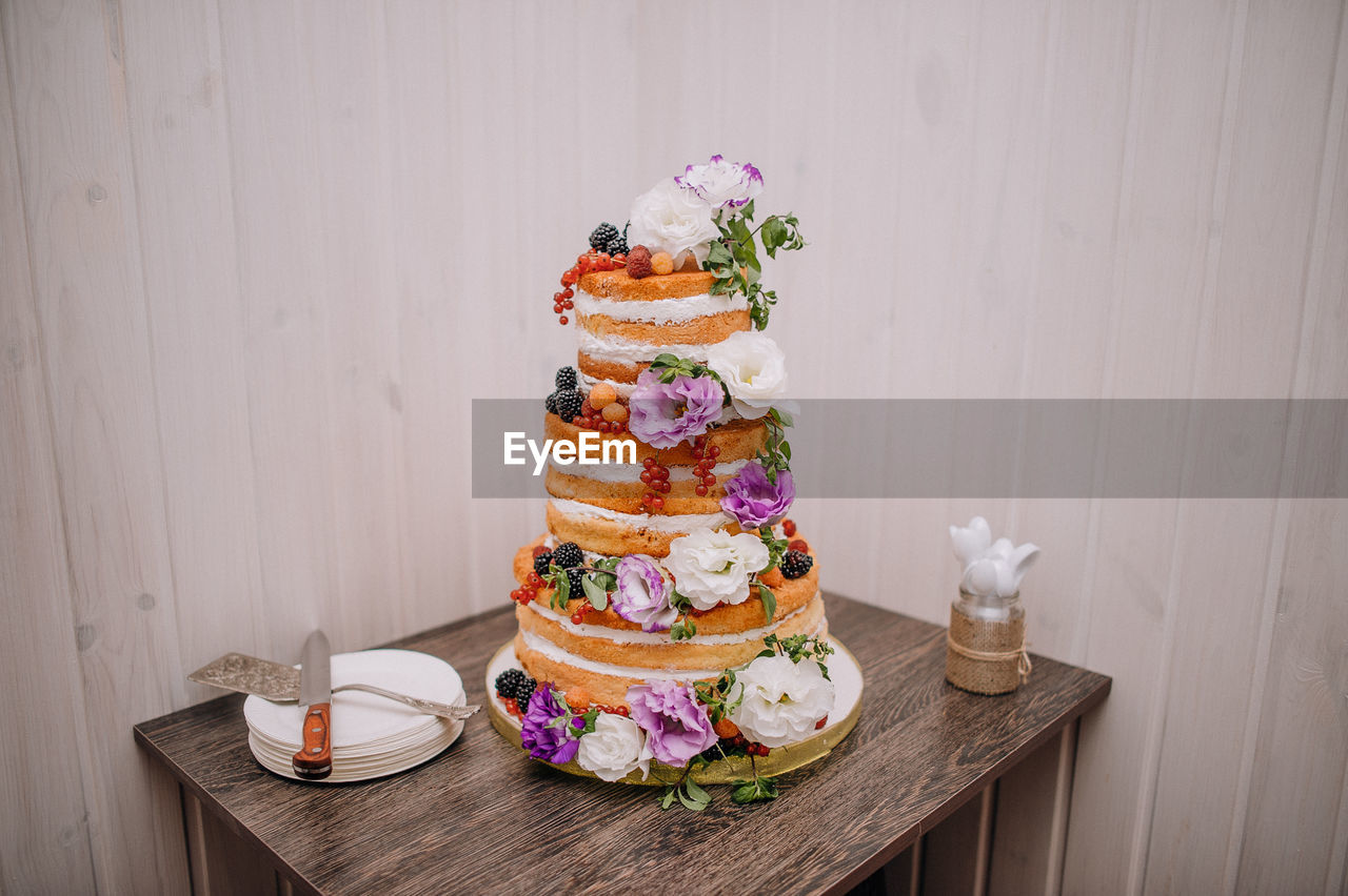 CLOSE-UP OF BIRTHDAY CAKE ON TABLE