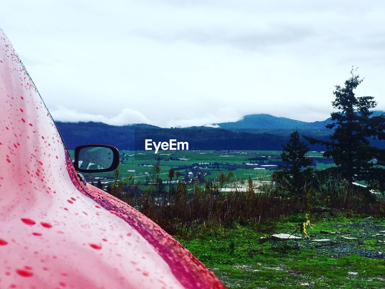 CARS ON MOUNTAIN AGAINST SKY