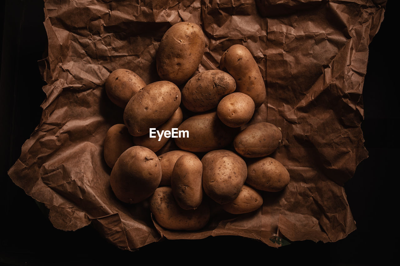 High angle view of patatoes on paper background