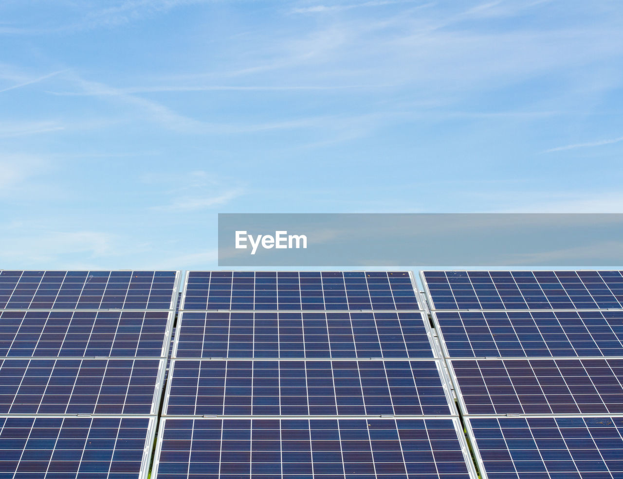 Low angle view of solar panels against sky