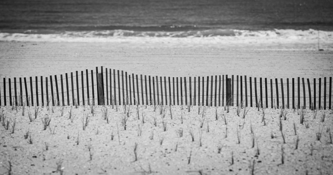 Wooden fence on beach