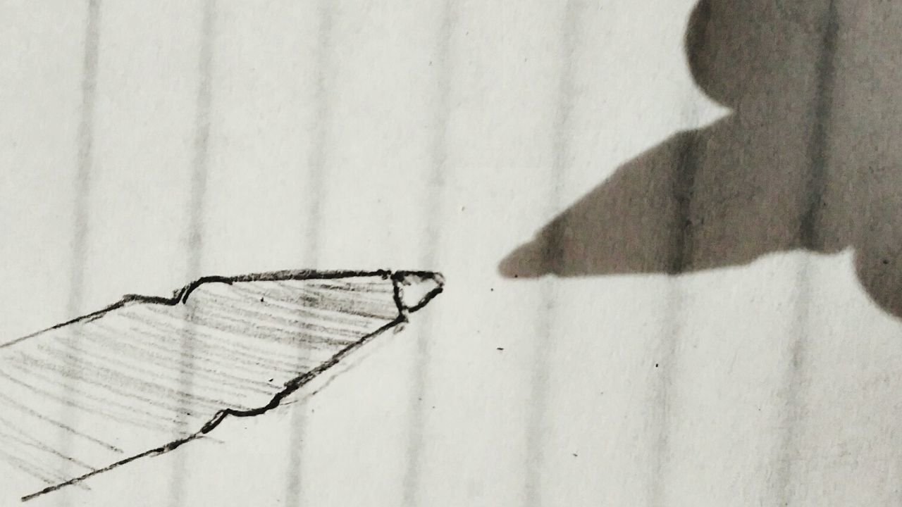 CLOSE-UP OF SHADOW ON WALL