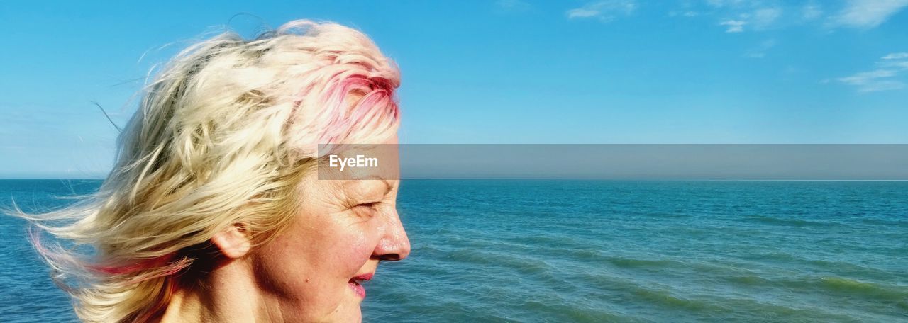Mature woman looking at sea