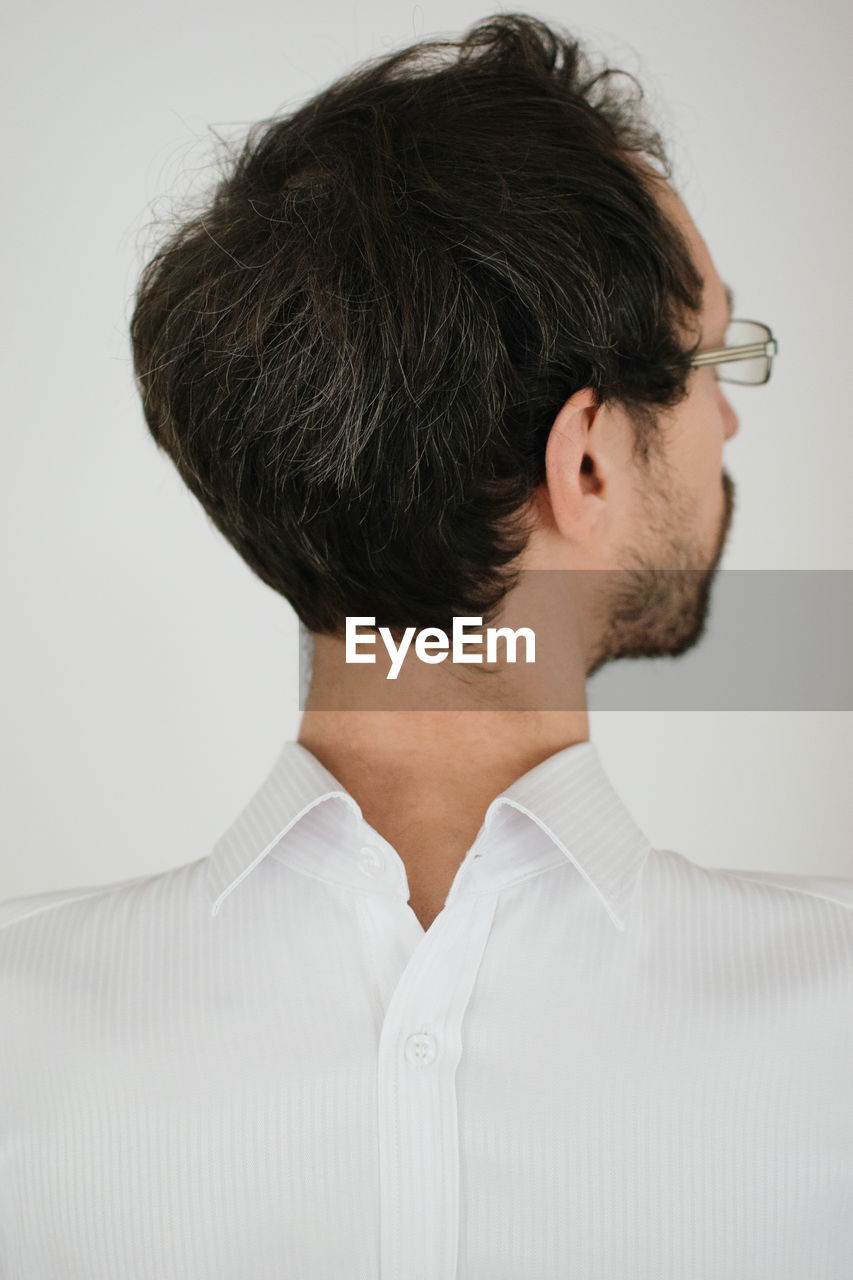 Man wearing shirt against white background