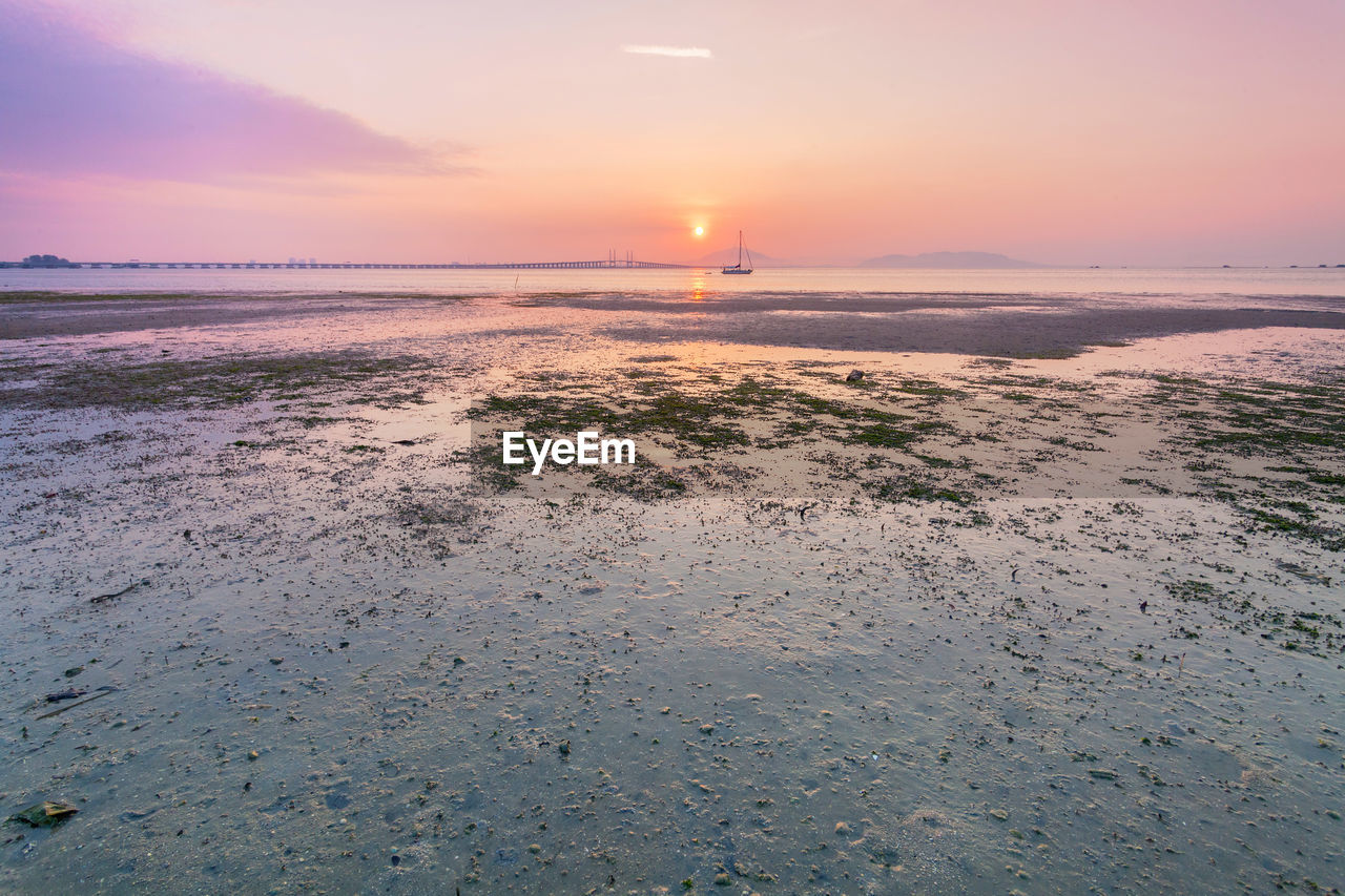 View of beach at sunset