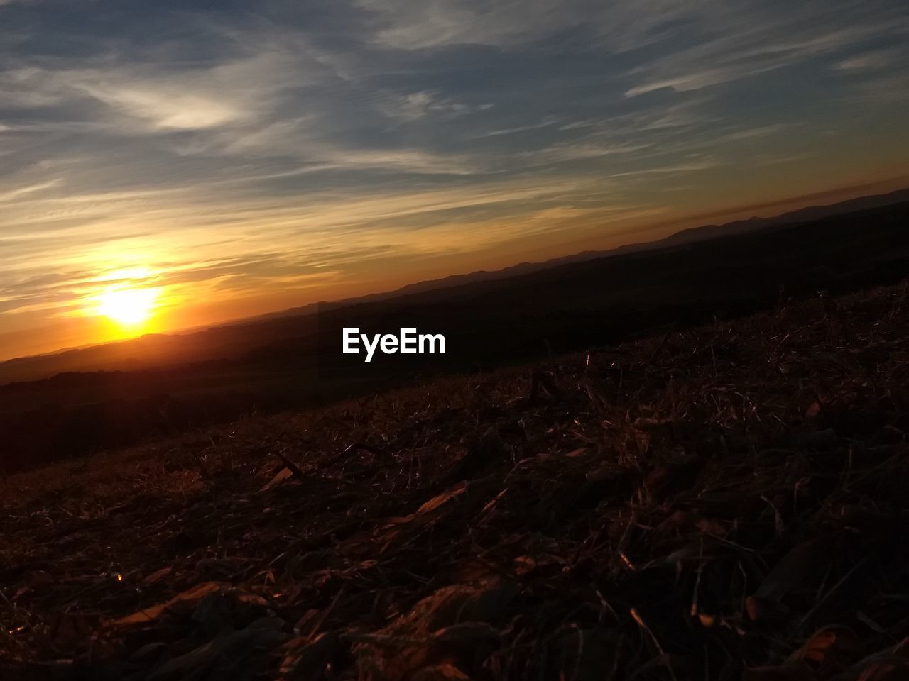 SCENIC VIEW OF SUNSET OVER LAND