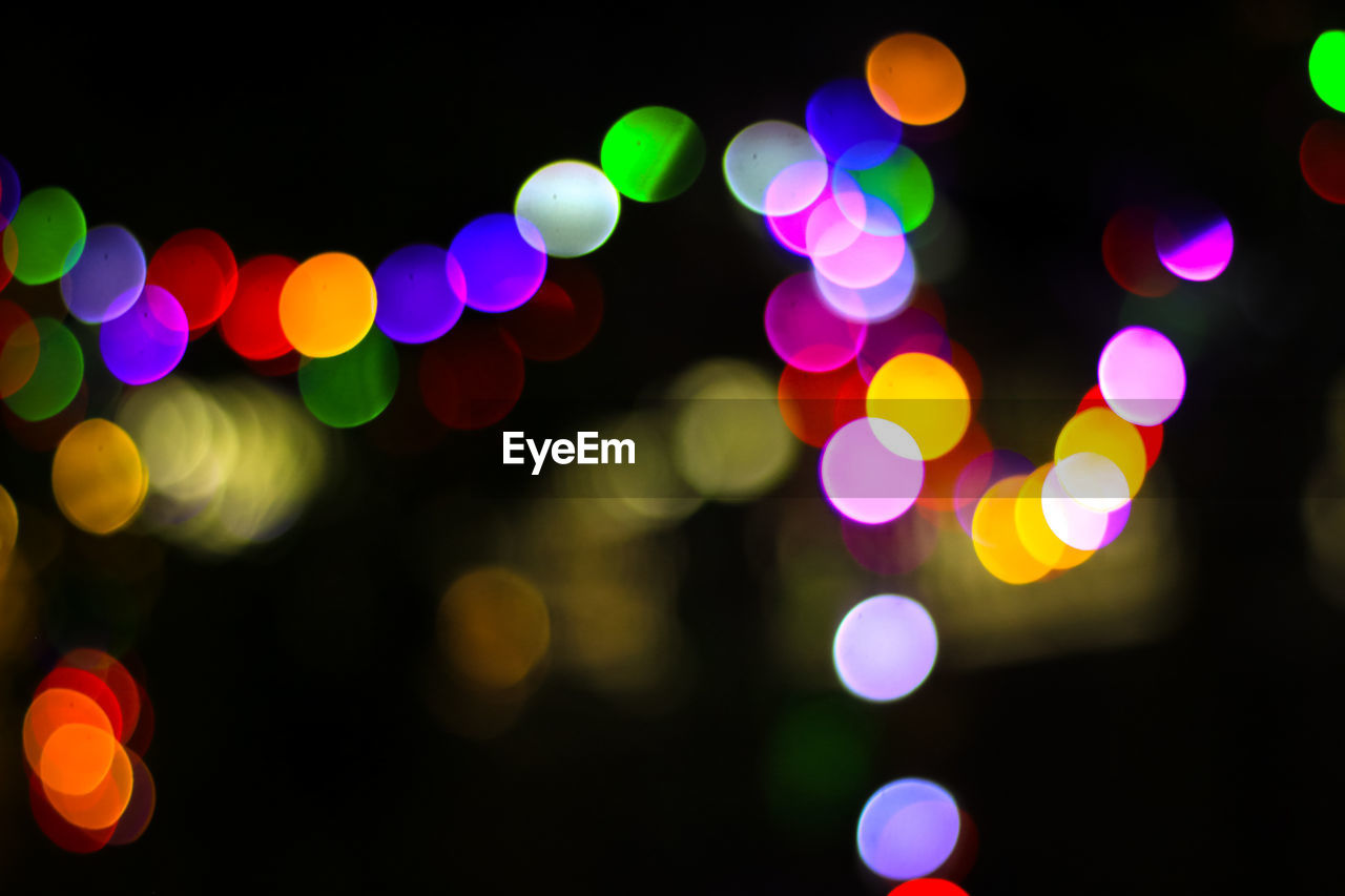 Defocused image of illuminated colorful lights