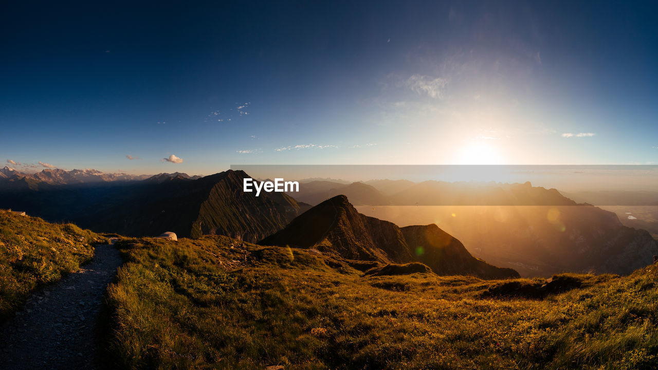 Scenic view of mountains against sky during sunset