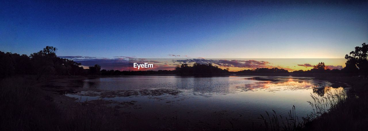 Panoramic view of river against blue sky during sunset