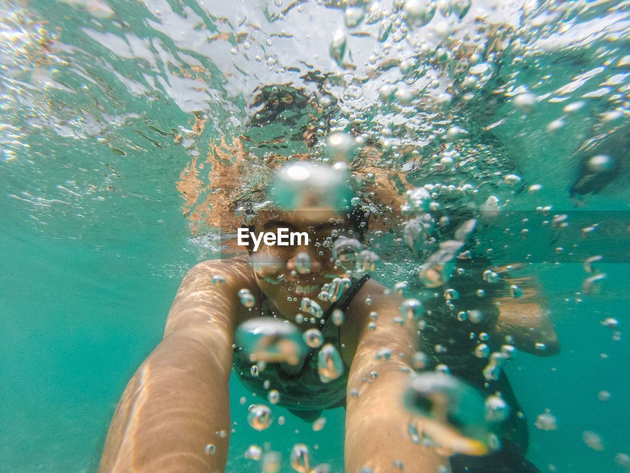 Close-up of man swimming in sea