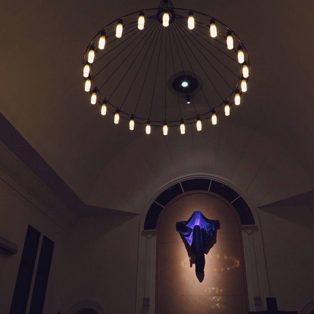 LOW ANGLE VIEW OF ILLUMINATED CEILING OF BUILDING