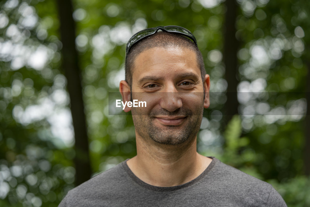 Portrait of smiling young man outdoors