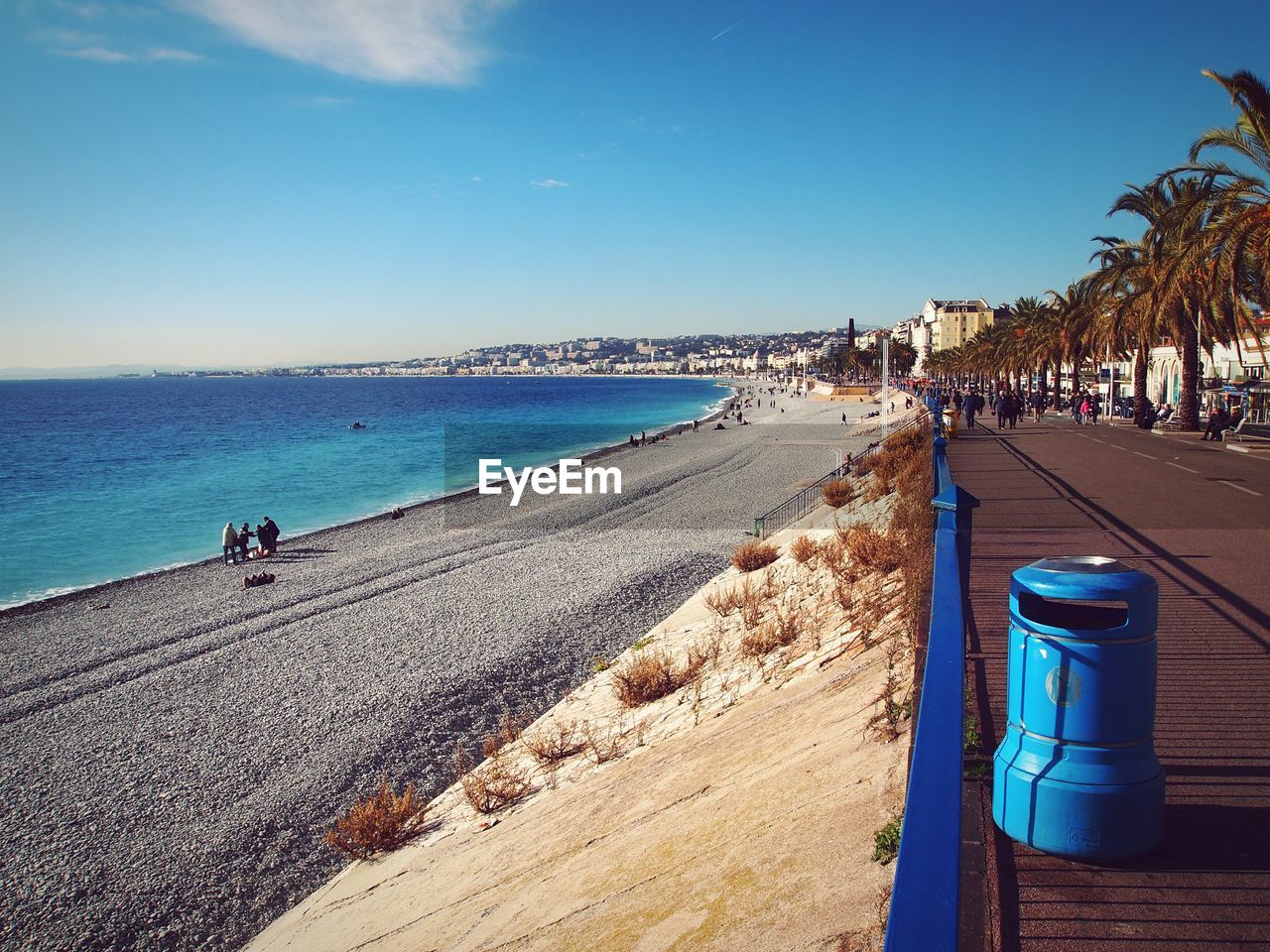 Scenic view of beach against blue sky