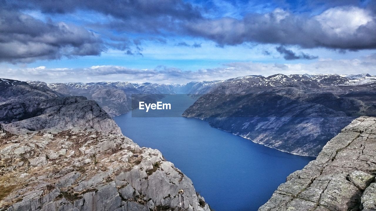 High angle view of river against cloudy sky