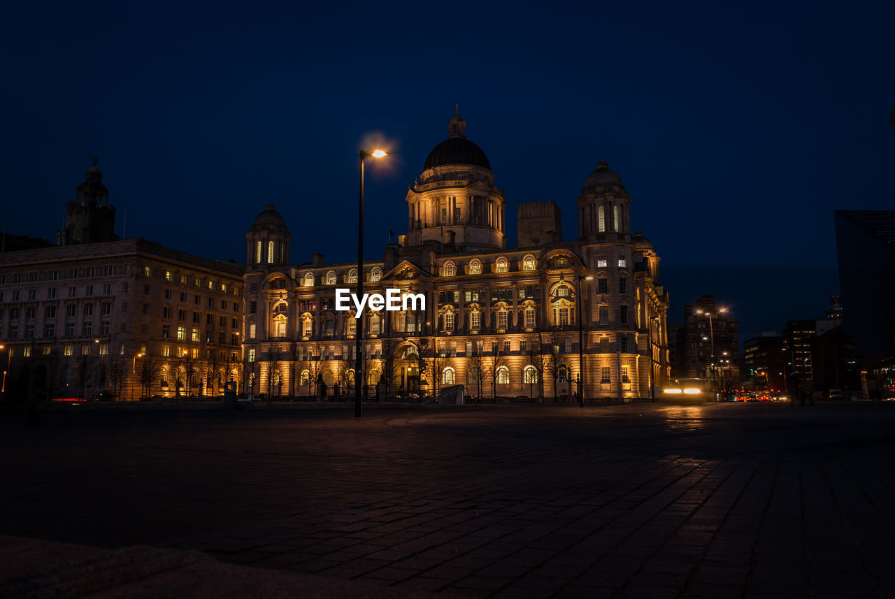 Historic buildings in city against sky