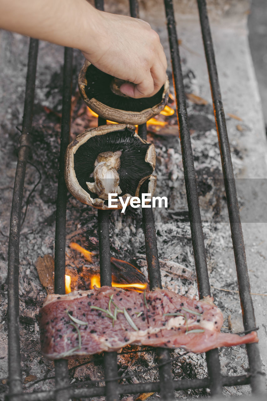 Cropped hand of man preparing food